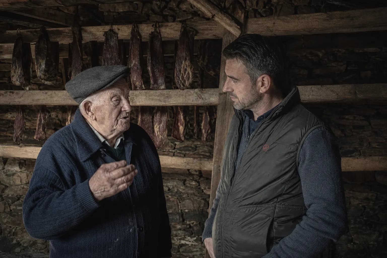 Nacho Robles's grandfather shows him the drying house in Vegacervera
