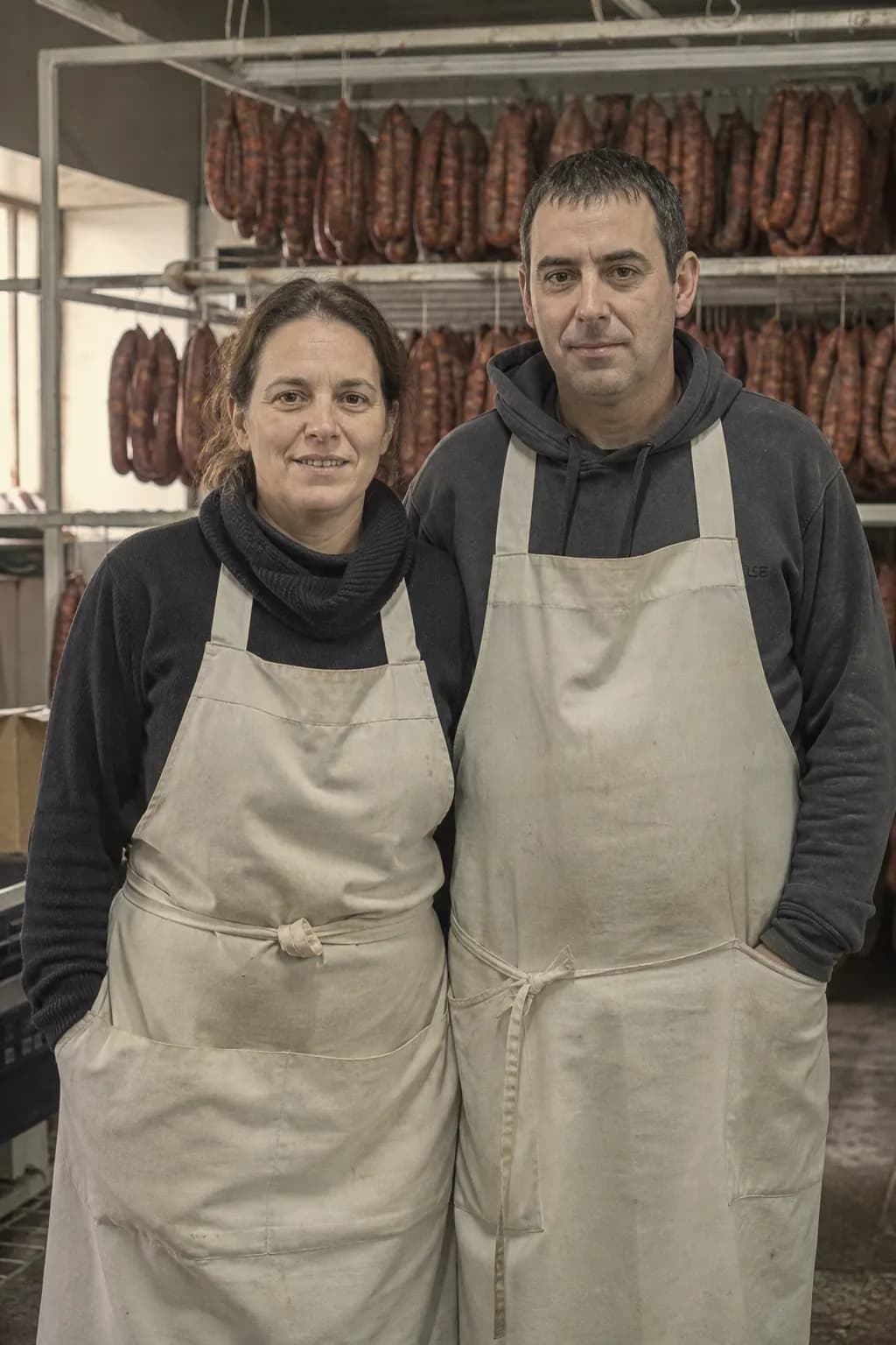 Mónica and Óscar Velasco in their parents' chorizo workshop in Cantimpalos
