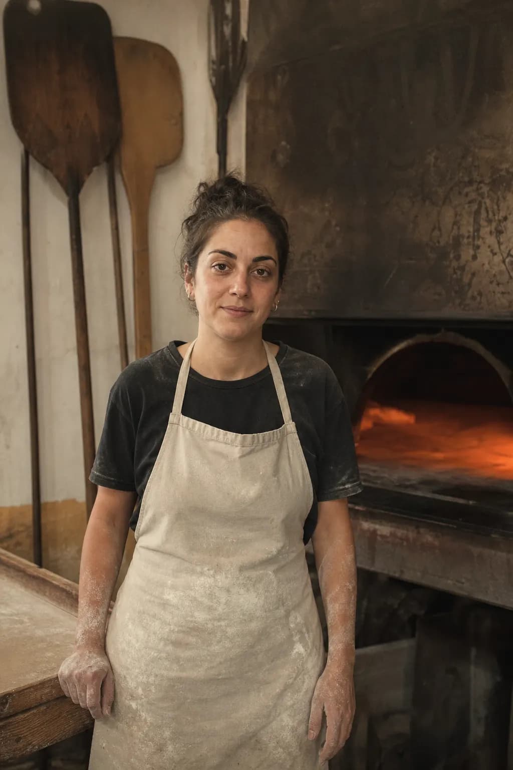 Aina Ramis, aged 27, in front of her grandfather's old bread oven in Algaida