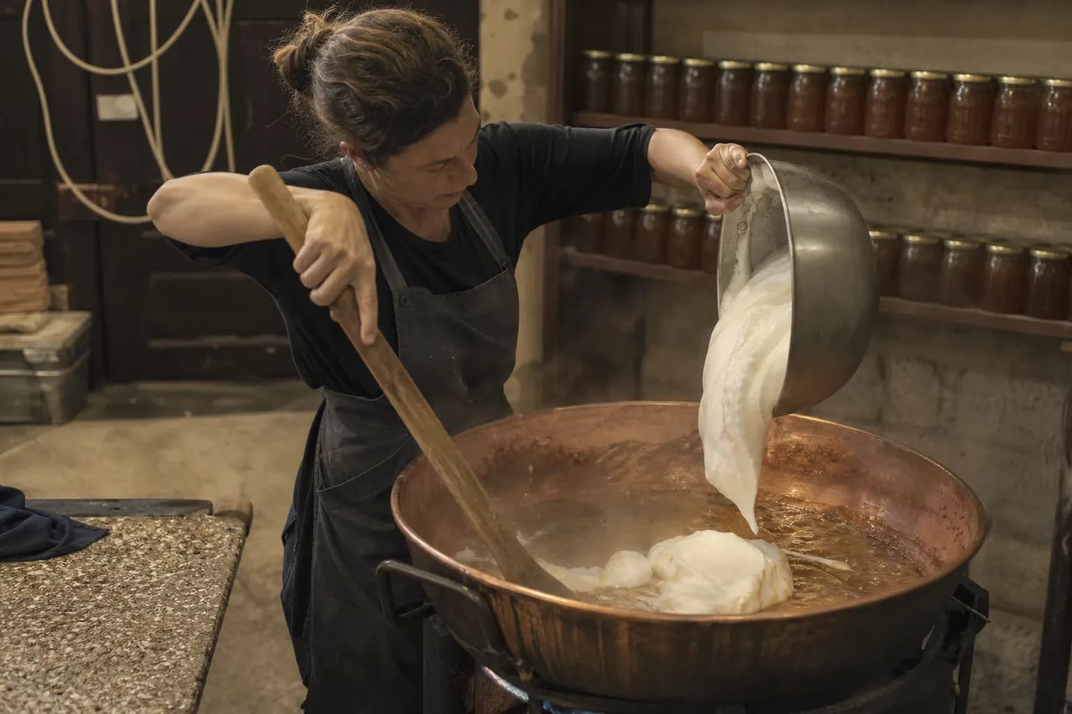 Clara Solé adds whipped egg white to the honey and sugar in a copper pot